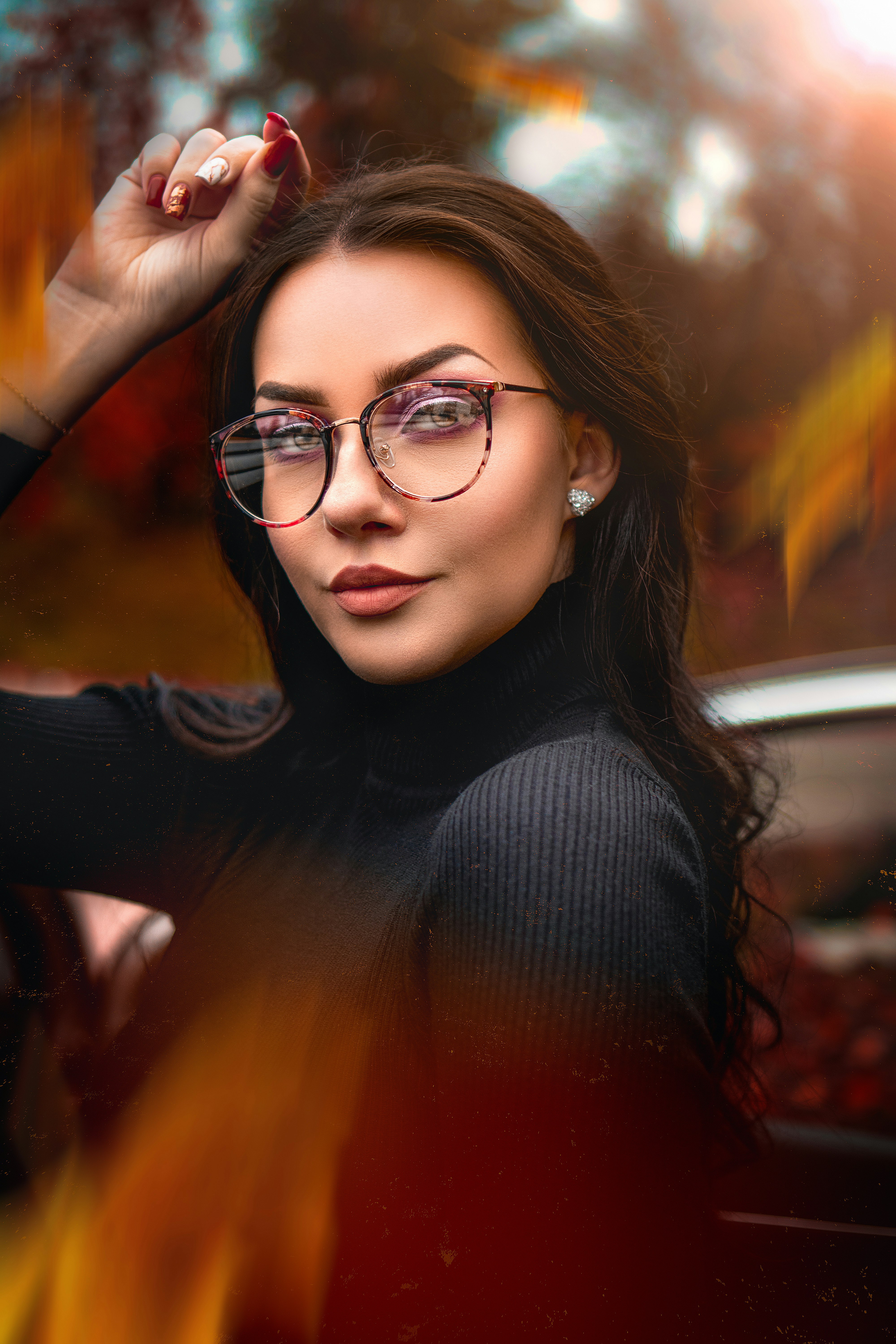 woman in black long sleeve shirt wearing black framed eyeglasses